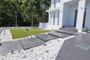 Modern concrete driveway and stepping stones by Ariyania Landscapes in Sydney.