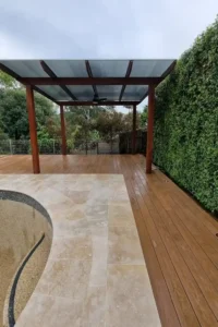 Custom timber pergola with a transparent roof by Ariyania Landscapes in a Sydney backyard.