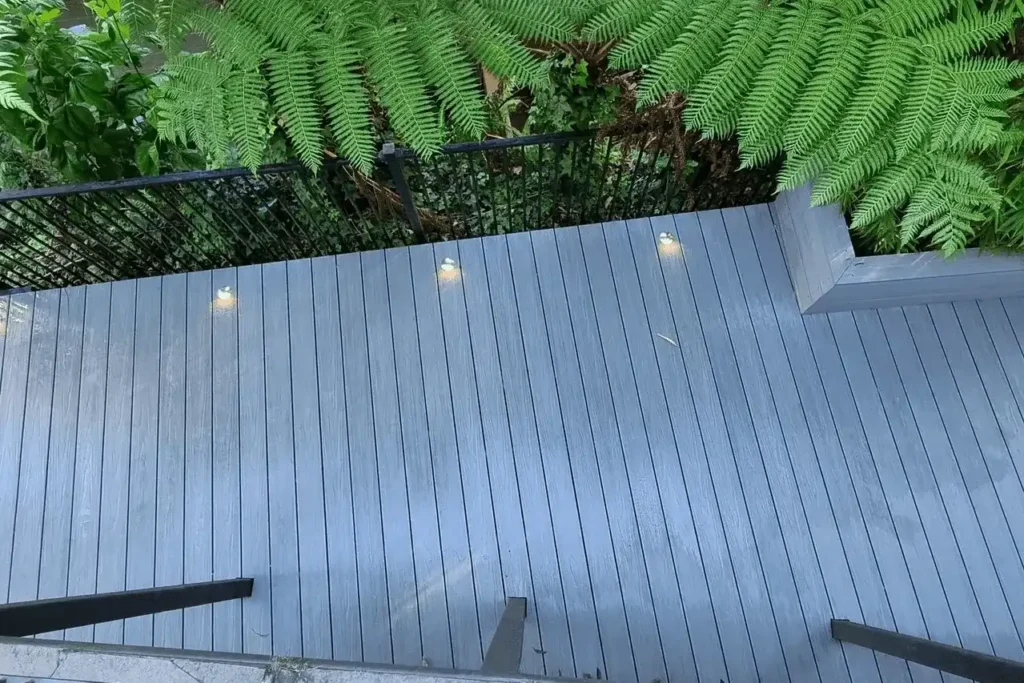 Contemporary Sydney garden with deck ideas, balustrades and ambient deck lighting.