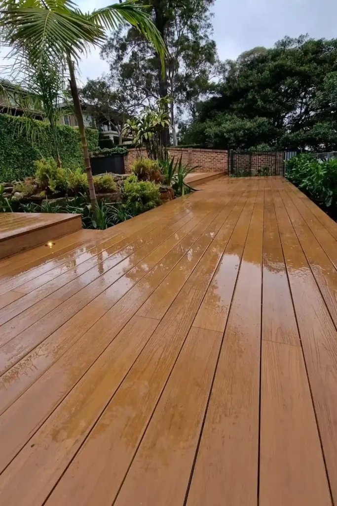 Beautiful hardwood decking installation in a modern backyard.