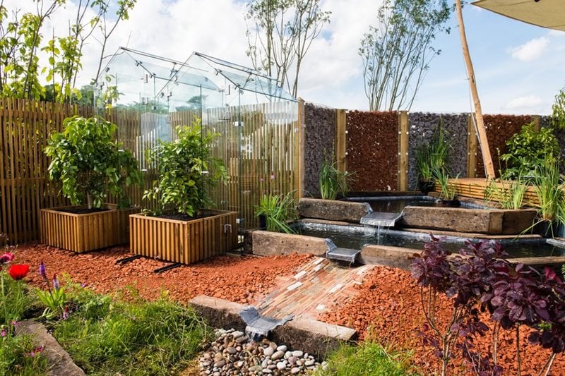 Modern residential landscaping design with stone pathway and greenery in Sydney